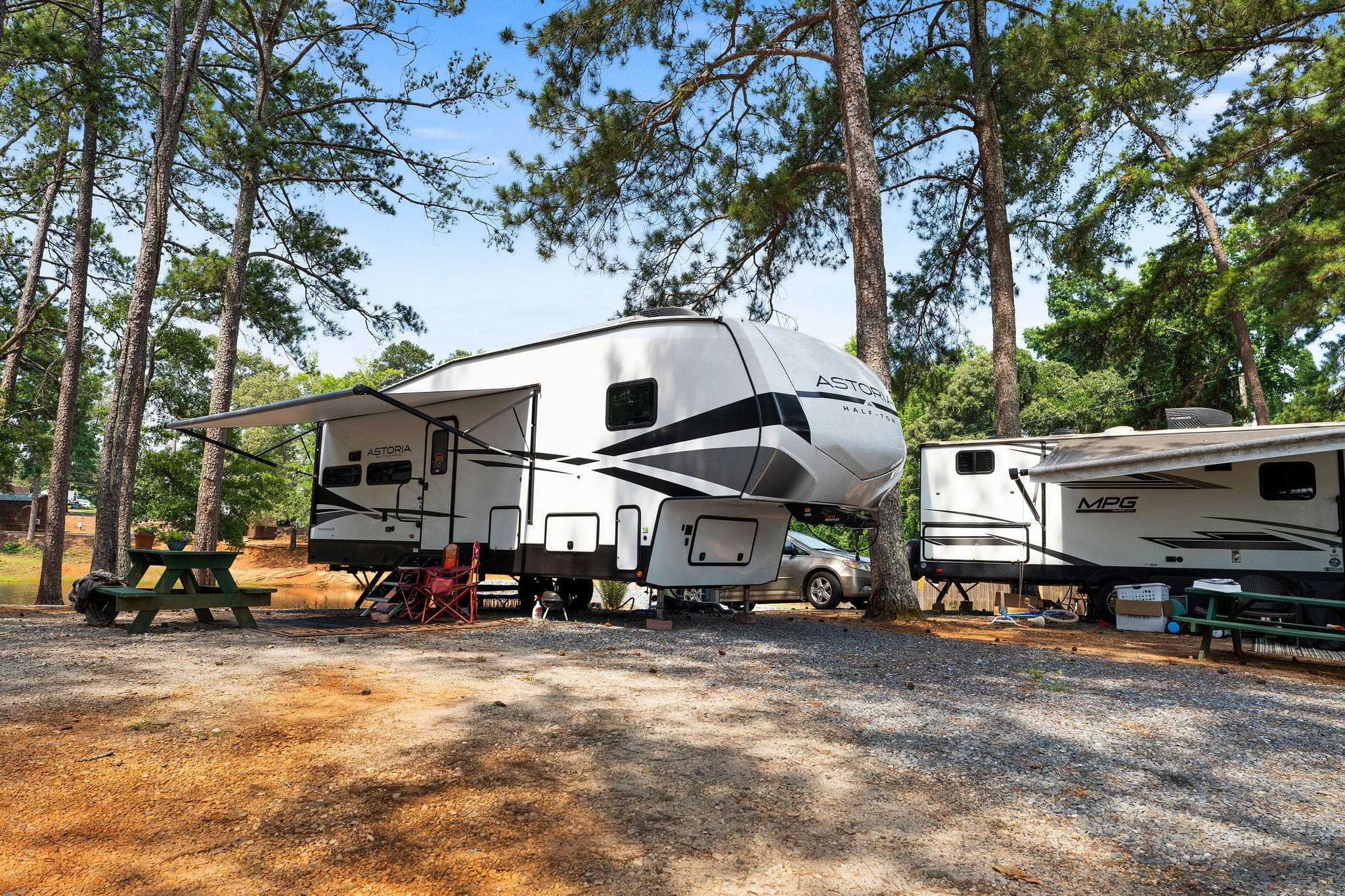 RVs parked along a gravel road at Forsyth Station RV Resort